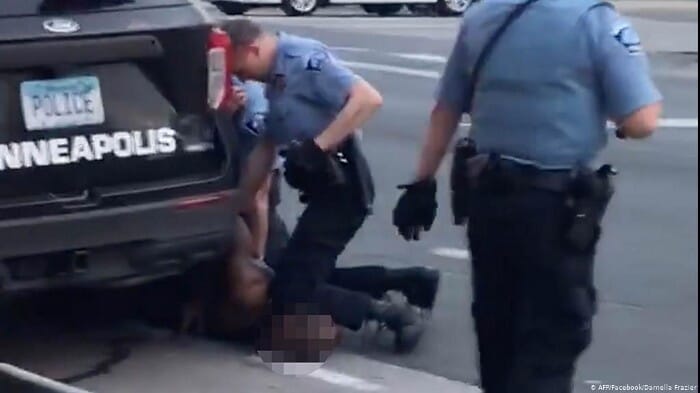 Policeman hurting a man